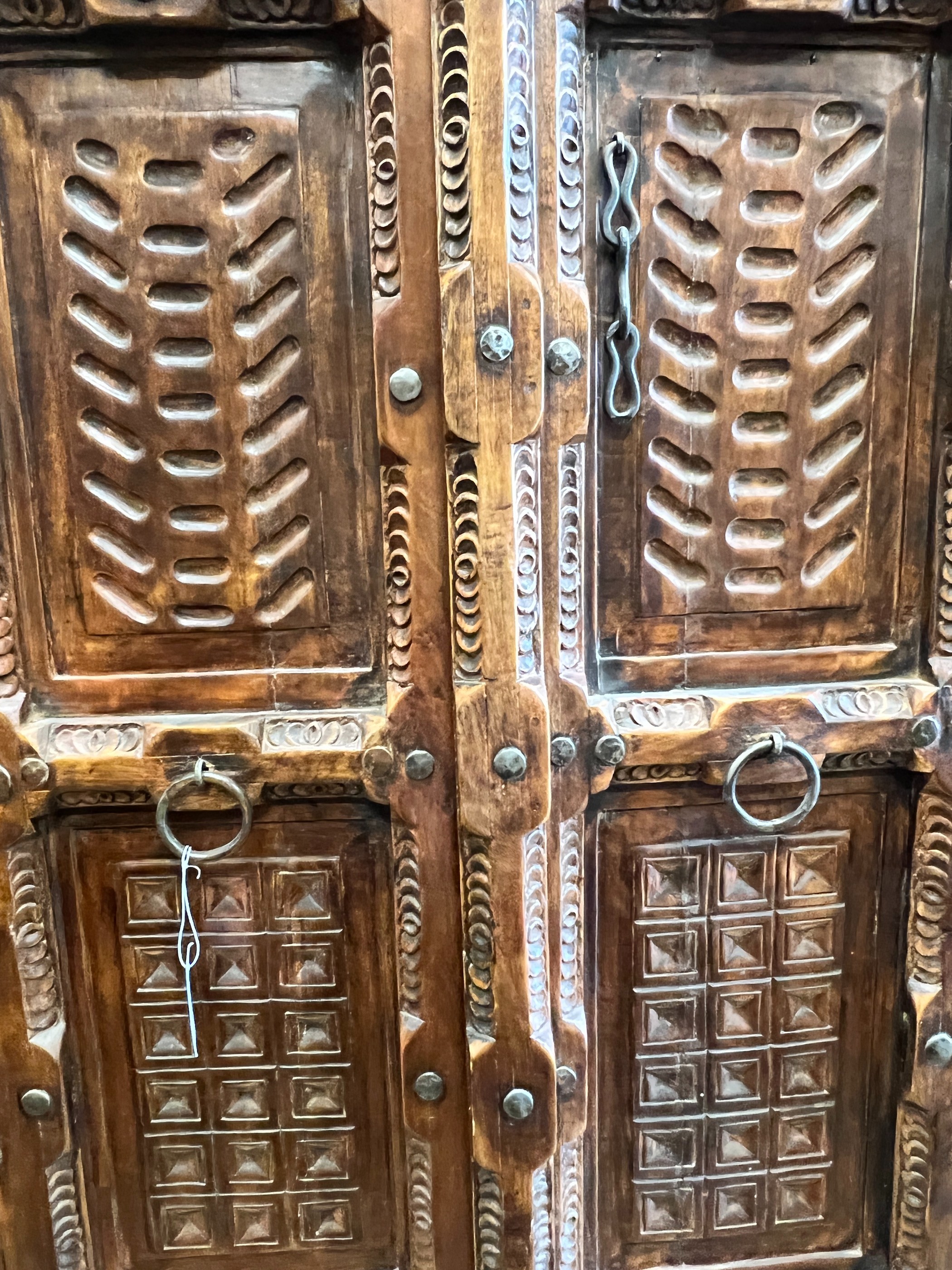 An Eastern carved hardwood two door cabinet, width 119cm, depth 67cm, height 192cm